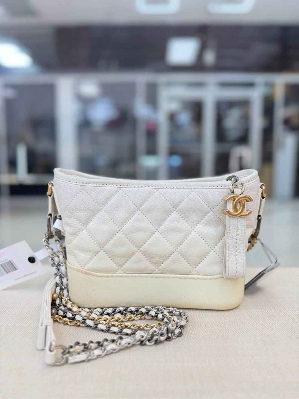 CHANEL White Quilted Leather Crossbody with Mixed Metal Chain and CC Charm